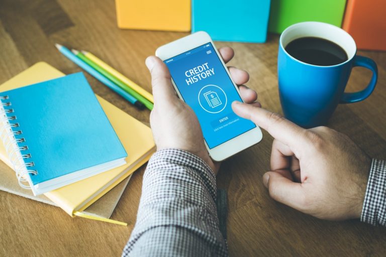 Man looking at credit history on phone