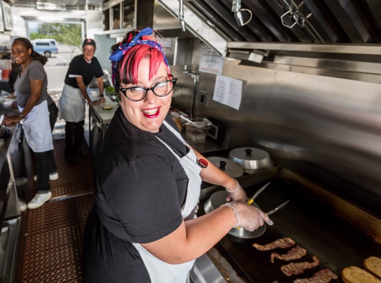 Woman grilling in a food truck
