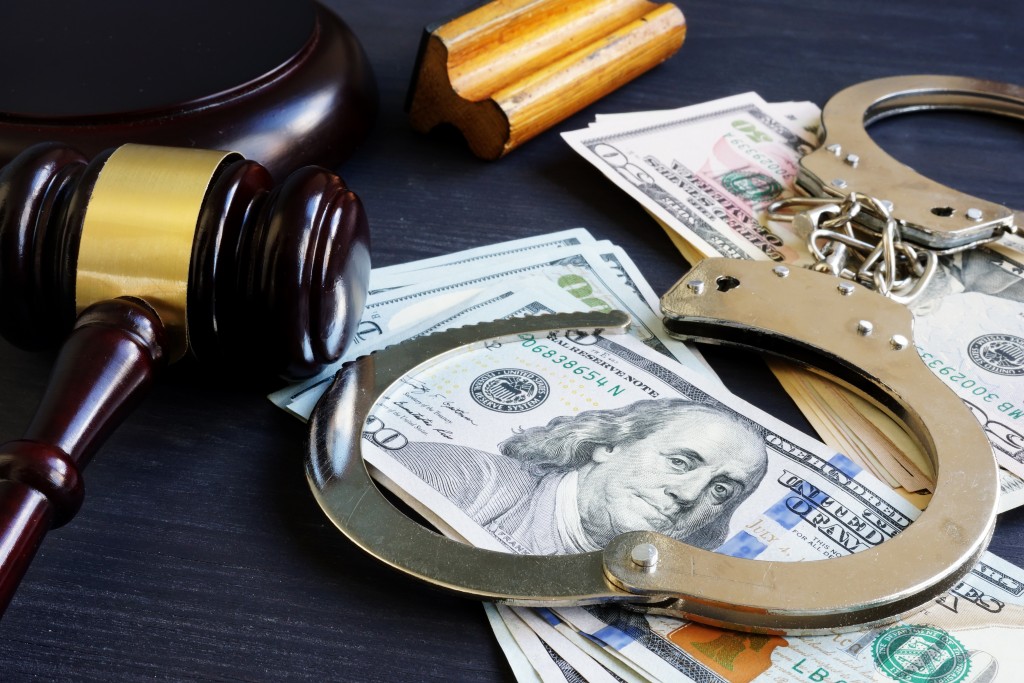 bail concept with gavel, money and handcuffs