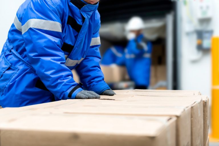 Man packaging boxes