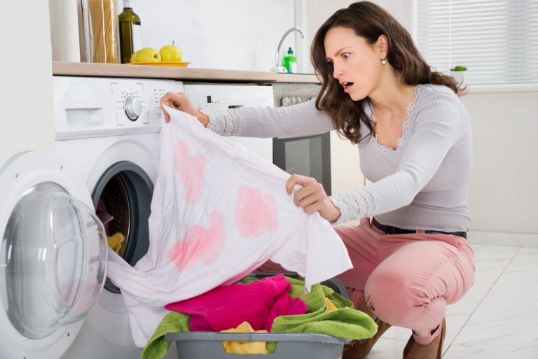 Woman looking at stained clothing