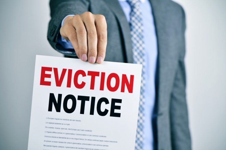 man holding eviction notice