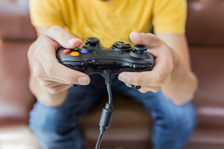 Man playing a gaming console