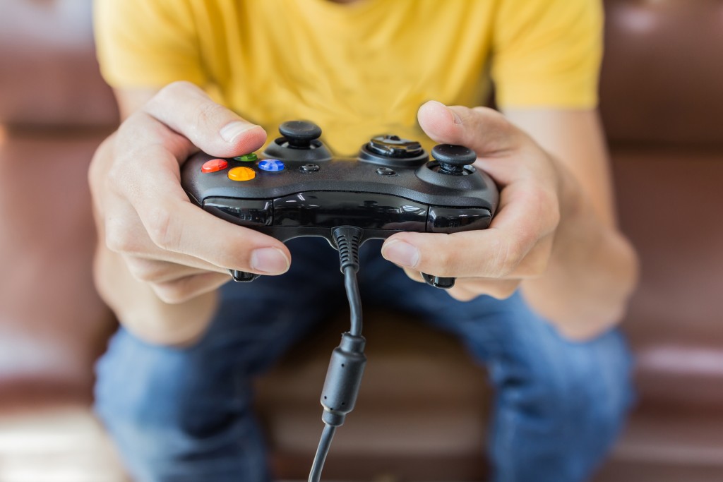 Man playing a gaming console
