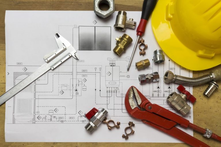 construction tools on top of a blueprint