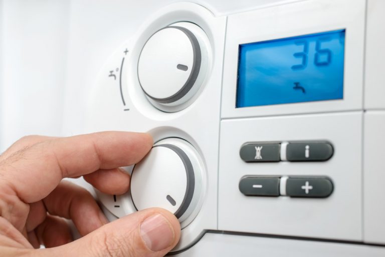 adjusting temperature on thermostat