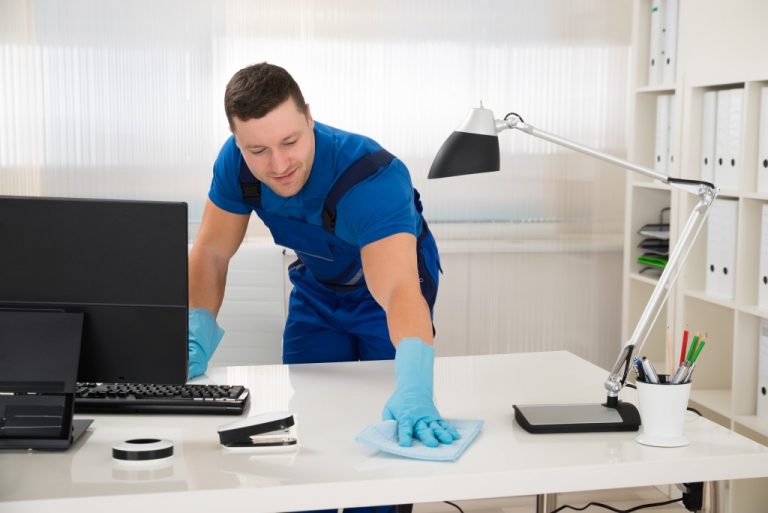 man cleaning the office desk