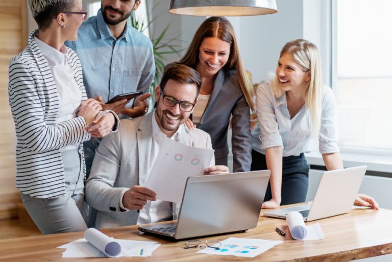 boss and employees happily discussing with each other