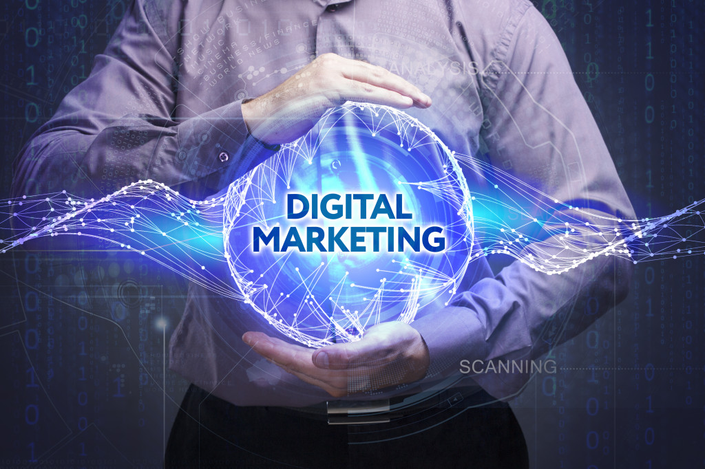 Man holding a digital marketing in his hands