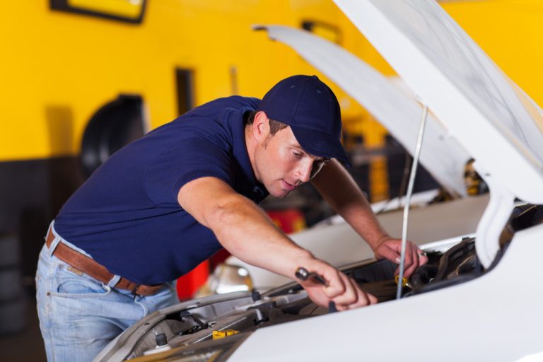 mechanic working on a car