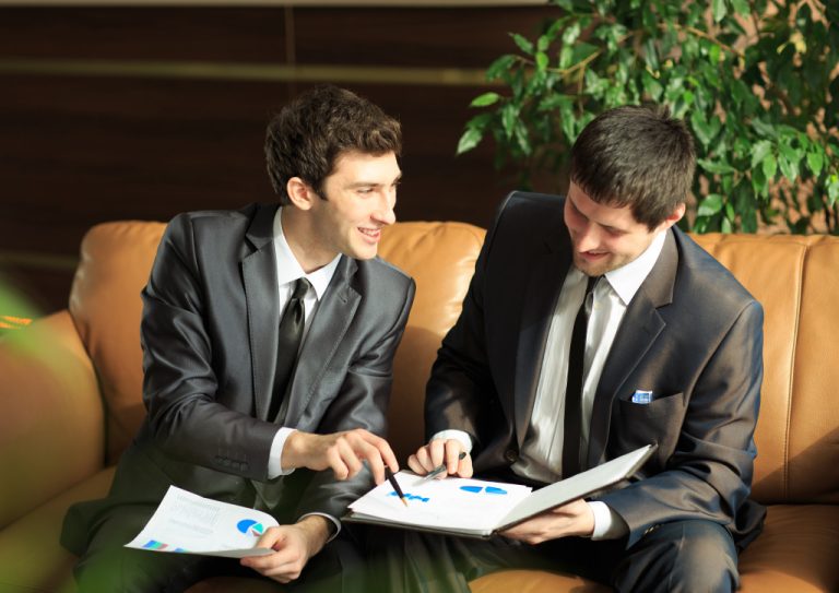 two business men discussing their plans for the company