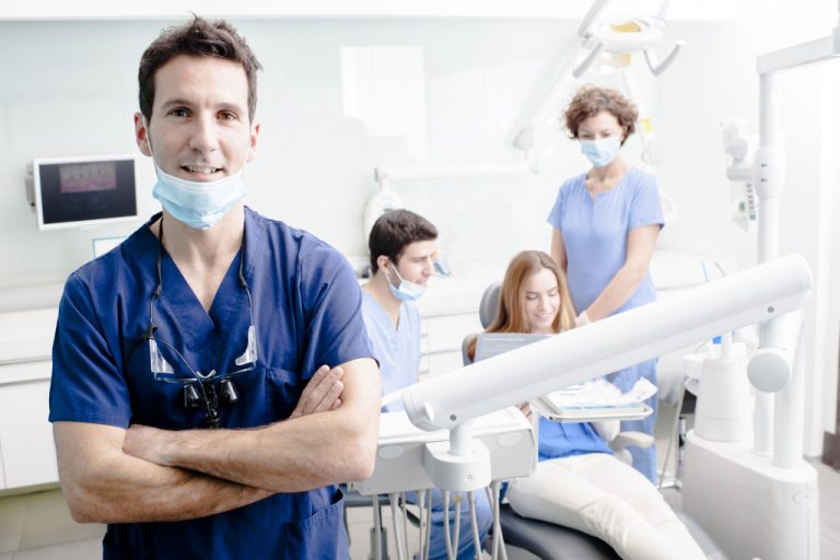 dentist with his staffs and a patient