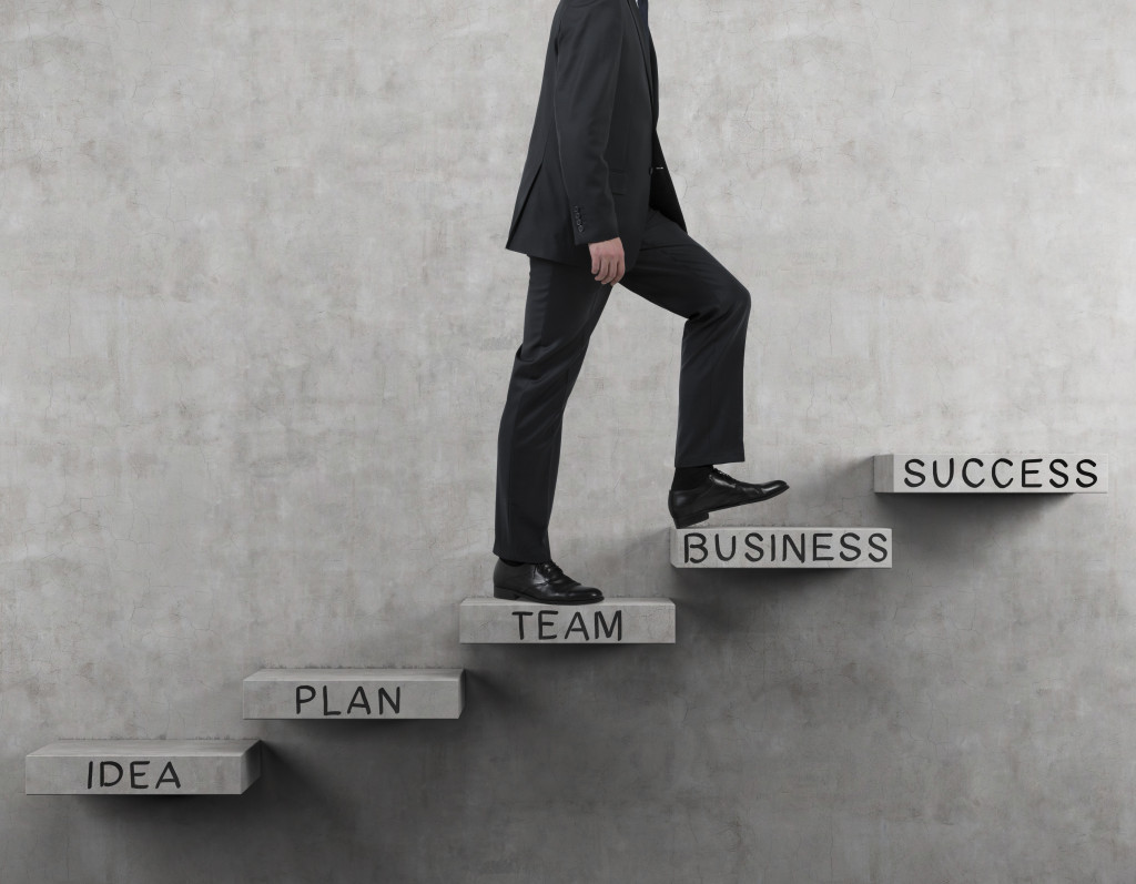 a person climbing a stair to success
