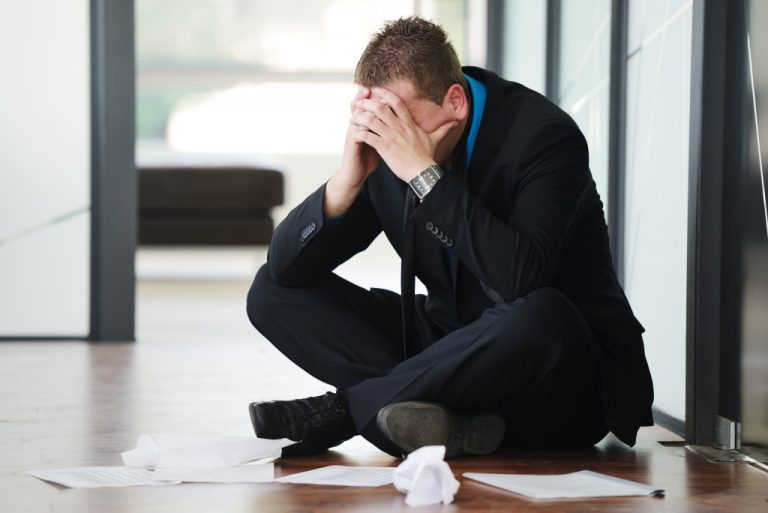 A depressed businessman who's afraid of bankruptcy est businessman who's afraid of bankruptcy